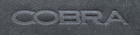 An example of an embossed Cobra logo on some Dinamica