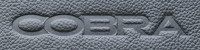 An example of an embossed Cobra logo on some leather