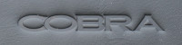 An example of an embossed Cobra logo on some nappa leather