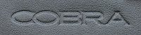 An example of an embossed Cobra logo on some vinyl
