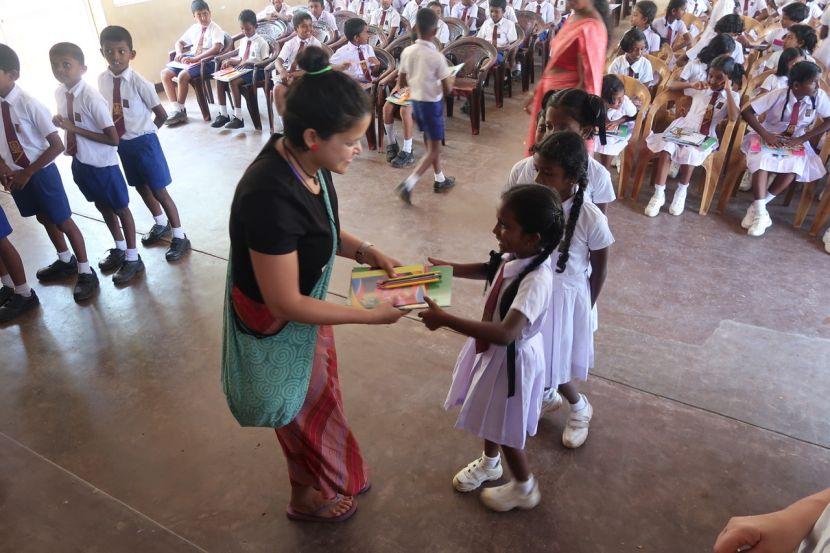 volunteers donating school supplies to sri lankan children